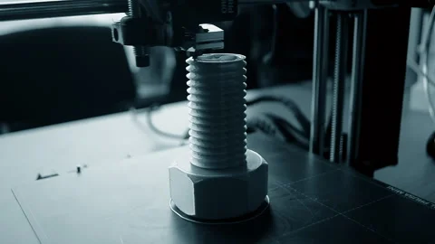 3D printer printing an object A 3D printer printing object from molten plastic Stock Footage 328717631