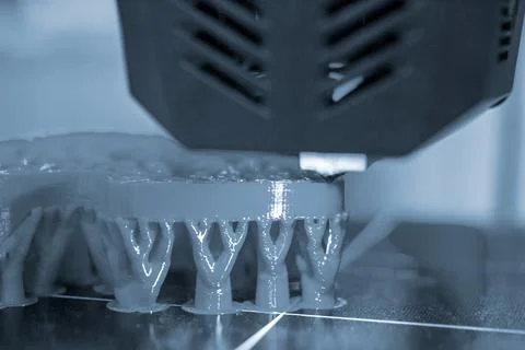 3D printer printing object close-up. Process creating three-dimensional model Stock Photos