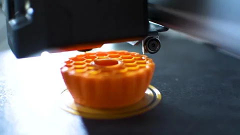 3d printer printing an object on the tray with pla filament, corn starch Stock Footage 308368728