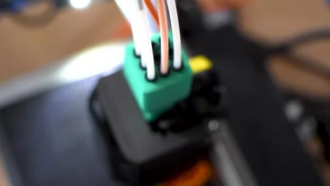 3d printer printing an object on the tray with pla filament, corn starch Stock Footage 308368740