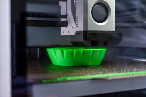 3d printer printing an object on the tray with pla filament, corn starch, n.. Stock Photos