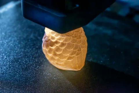 3d printer printing an object on the tray with pla filament, corn starch Stock Photos