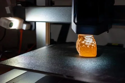 3d printer printing an object on the tray with pla filament, corn starch Stock Photos