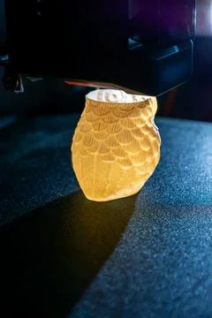 3d printer printing an object on the tray with pla filament, corn starch Stock Photos