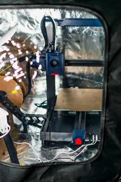 3d printer printing an object on the tray with filament Stock Photos
