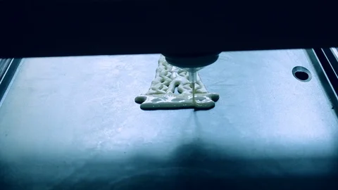 3D printer printing pancakes with liquid dough different shapes close-up. Stock Footage 103071350