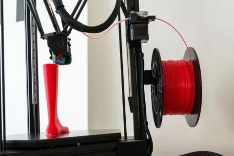 3d printer printing plastic last shoe prototype from red filament Stock Photos
