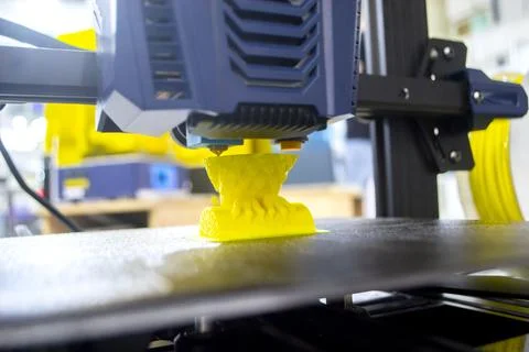 3D printer printing prototype from molten plastic. Process of creating prototype Stock Photos