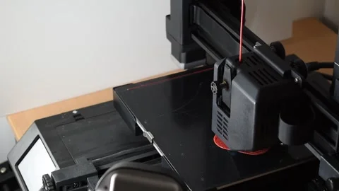 3d printer printing a red object, close-up Stock Footage 257788162