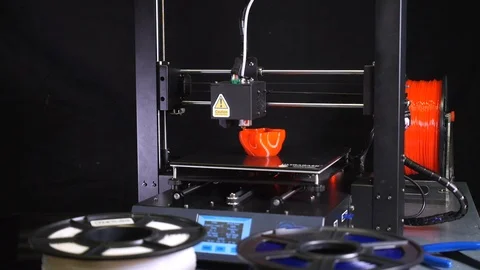 3D printer printing a red vase, Black background Stock Footage 104394647