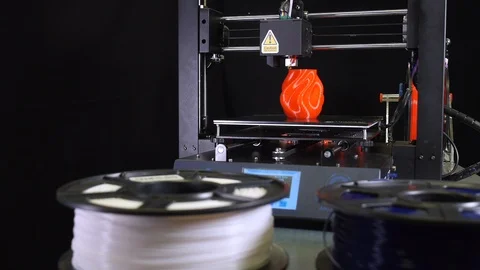 3D printer printing a red vase, Black background Stock Footage 104396862