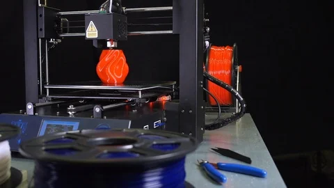 3D printer printing a red vase, Black background Stock Footage 104397555