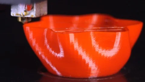 3D printer printing a red vase, Black background Stock Footage 104397571
