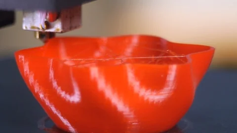 3D printer printing a red vase Stock Footage 104401201