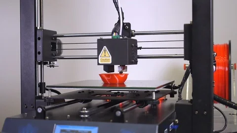 3D printer printing a red vase, White background Stock Footage 104402089