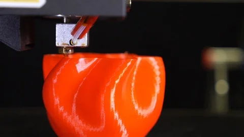 3D printer printing a red vase, Black background Stock Footage 104411867