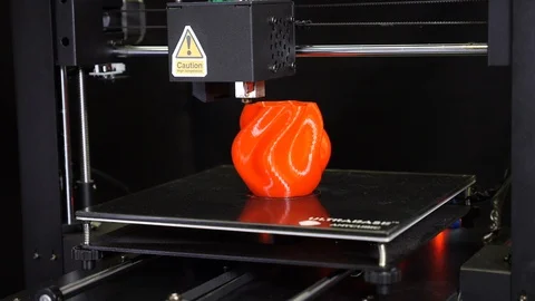 3D printer printing a red vase, Black background Stock Footage 104412086