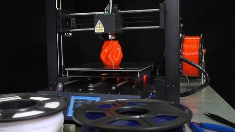 3D printer printing a red vase, Black background Stock Footage 104416082