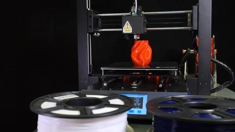 3D printer printing a red vase, Black background Stock Footage 104416149