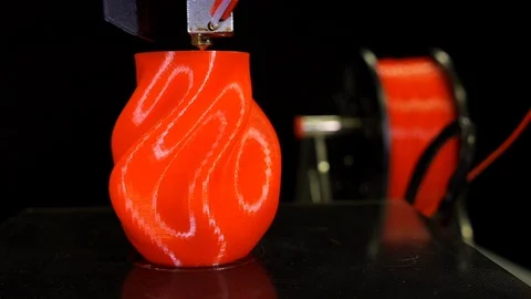 3D printer printing a red vase, Black background Stock Footage 104416219