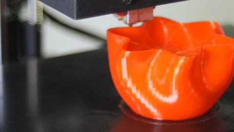 3D printer printing a red vase, White background Stock Footage 104418512