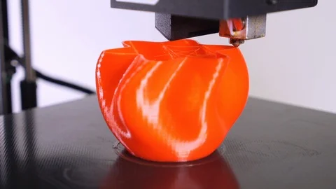 3D printer printing a red vase, White background Stock Footage 104671209