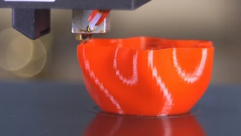3D printer printing a red vase Stock Footage 104742525