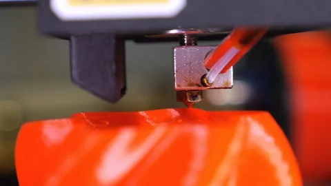 3D printer printing a red vase Stock Footage 104742812