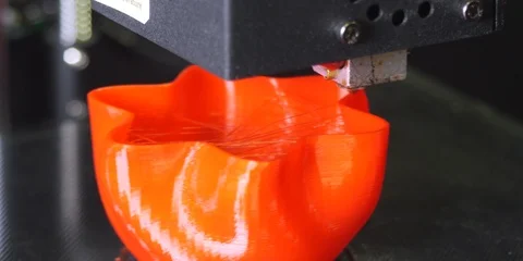 3D printer printing a red vase, Black background Video stock 104743265