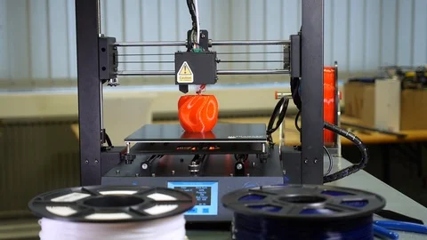 3D printer printing a red vase Stock Footage 104805166