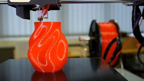 3D printer printing a red vase Stock Footage 104806207