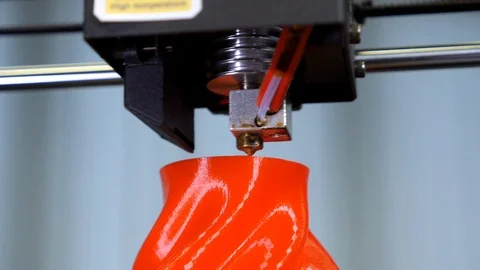 3D printer printing a red vase Stock Footage 104806351