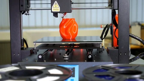 3D printer printing a red vase Stock Footage 104806722