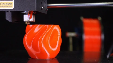 3D printer printing a red vase, Black background Stock Footage 104826401