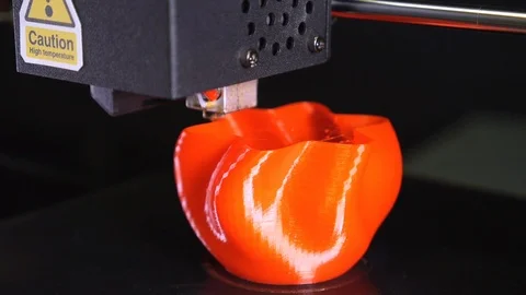 3D printer printing a red vase, Black background Stock Footage 104826597