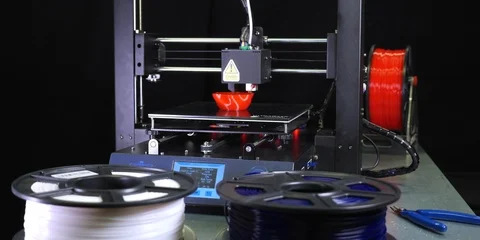 3D printer printing a red vase, Black background Stock Footage 104828716