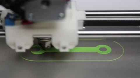 3d printer printing wrench with green filament Stock Footage 44532964