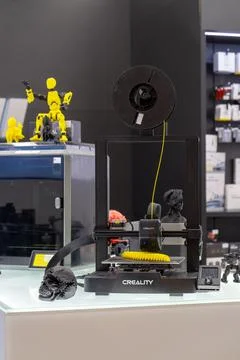 3D printer printing a yellow object model. Minsk, Belarus - March 16, 2025 Stock Photos