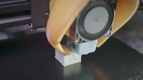 3D printer prints an abstract cubic figure from white abs plastic. The needle of 스톡 동영상 138423481