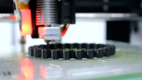 3d printer prints black object close-up. Automatic three dimensional 3D printer Stock Footage 147167900