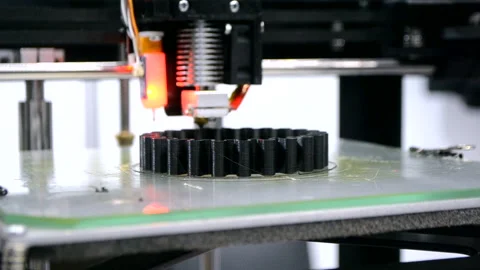 3d printer prints black object close-up. Automatic three dimensional 3D printer Stock Footage 147167901