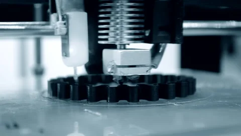 3d printer prints black object close-up. Automatic three dimensional 3D printer Stock Footage 153057355