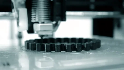 3d printer prints black object close-up. Automatic three dimensional 3D printer Stock Footage 153130287
