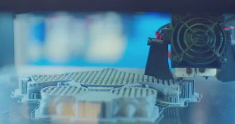 A 3D printer prints a complex plastic part. close-up. Stock Footage 196287018