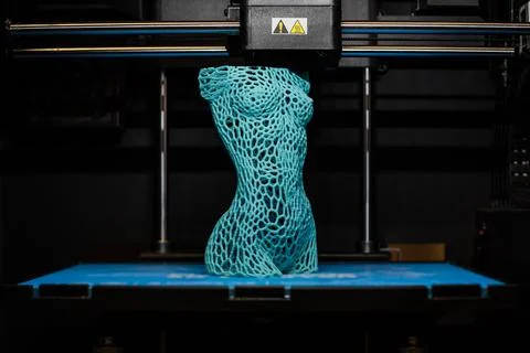 3d printer prints the model of female body, process of creating a bust of girl Fotos Stock