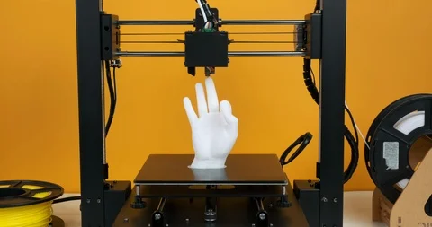 3D printer prints model hands made of white plastic yellow background Stock Footage 126409803