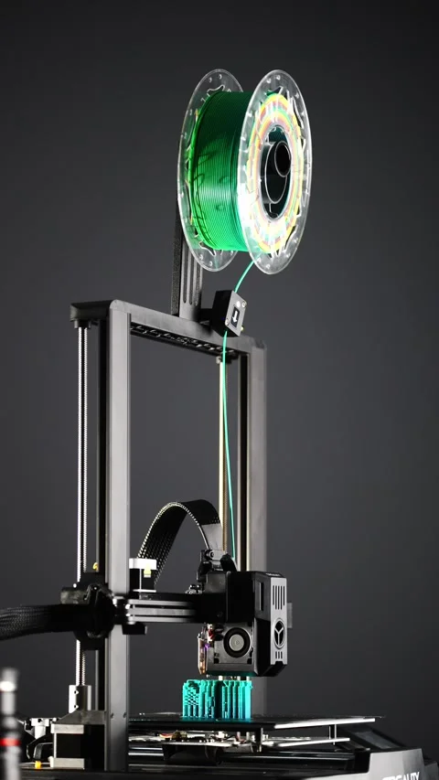 A 3D printer prints an object from plastic. Stock Footage 313234931