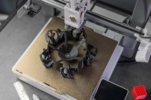 3D printer prints an object. The process of printing model on 3D printer. Model Stock Photos