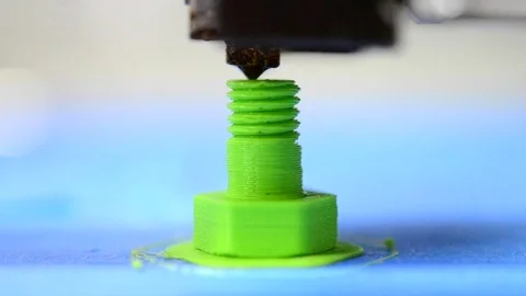 3D printer prints from the plastic figure in the form bolt Stock Footage 69780283