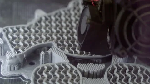 A 3D printer prints a plastic figurine. Stock Footage 170362594